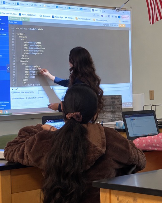 Me leading a Girls Who Code session